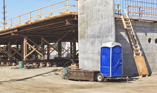 a necessary and important addition to any job site - portable toilets for workers' comfort